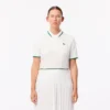 Polo de tenis con cuello a rayas y protección UV para mujer