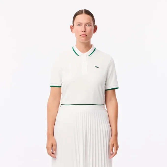Polo de tenis con cuello a rayas y protección UV para mujer