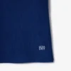 Polo de tenis con cuello a rayas y protección UV para mujer