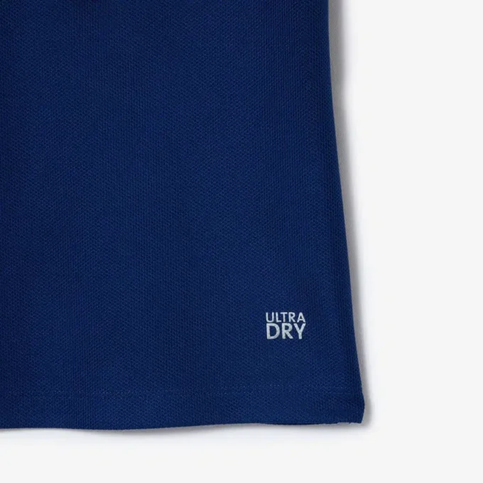 Polo de tenis con cuello a rayas y protección UV para mujer