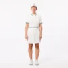 Polo de tenis con cuello a rayas y protección UV para mujer