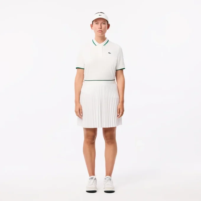 Polo de tenis con cuello a rayas y protección UV para mujer