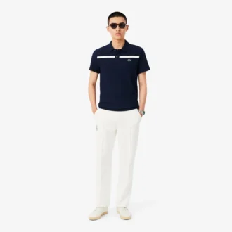 Polo de tenis Heritage para hombre con detalle de insignia Ultra Dry