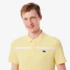 Polo de tenis Heritage para hombre con detalle de insignia Ultra Dry