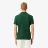 Polo de tenis Heritage para hombre con detalle de insignia Ultra Dry
