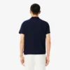 Polo de tenis Heritage para hombre con detalle de insignia Ultra Dry