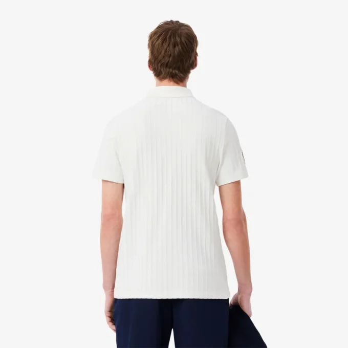 Polo de tenis Heritage para hombre con detalle de insignia Ultra Dry