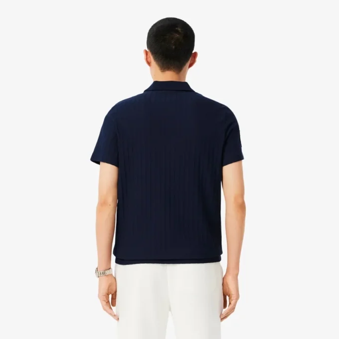 Polo de tenis Heritage para hombre con detalle de insignia Ultra Dry