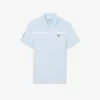 Polo de tenis Heritage para hombre con detalle de insignia Ultra Dry