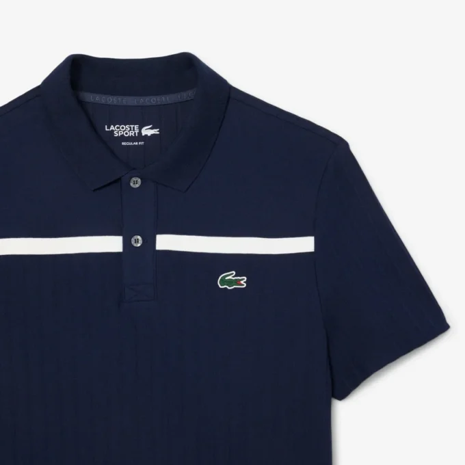 Polo de tenis Heritage para hombre con detalle de insignia Ultra Dry