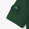 Polo de tenis Heritage para hombre con detalle de insignia Ultra Dry