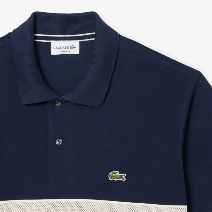 Polo L.12.12 de corte clásico con rayas llamativas para hombre