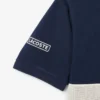 Polo L.12.12 de corte clásico con rayas llamativas para hombre