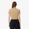 Polo L.12.D de mujer, corte ajustado y elástico, con tejido piqué