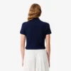 Polo L.12.D de mujer, corte ajustado y elástico, con tejido piqué