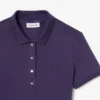 Polo L.12.D de mujer, corte ajustado y elástico, con tejido piqué