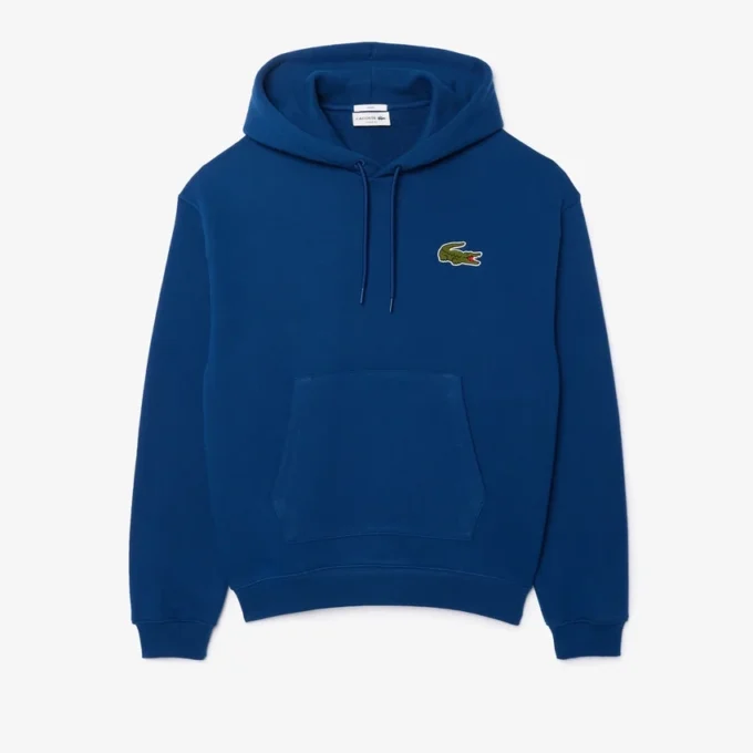 Sudadera con capucha unisex de corte holgado y detalle de insignia