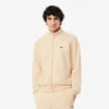 Sudadera con cremallera y detalles decorativos