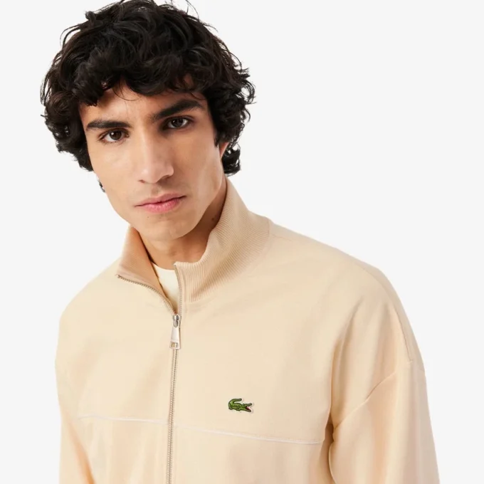 Sudadera con cremallera y detalles decorativos