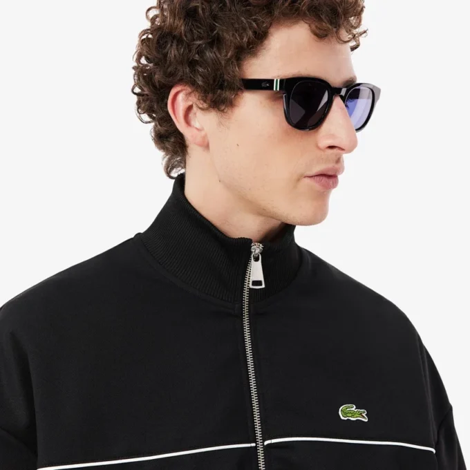 Sudadera con cremallera y detalles decorativos