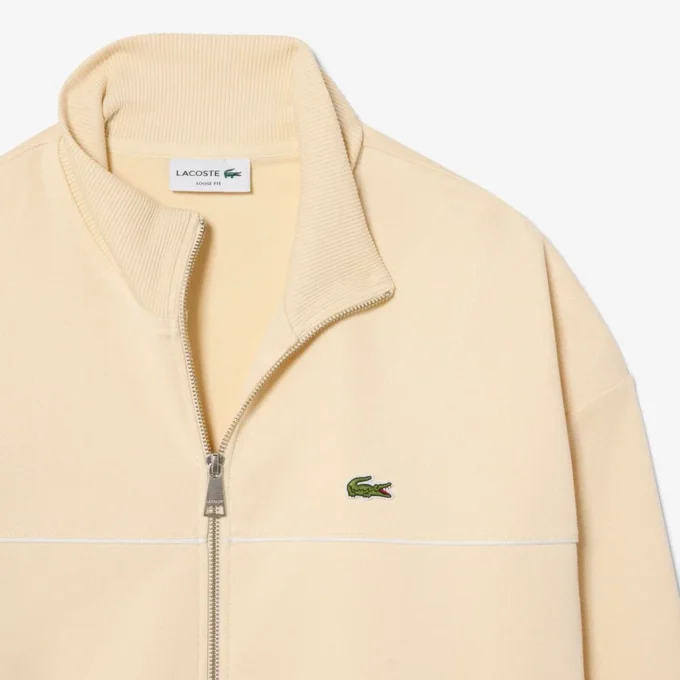 Sudadera con cremallera y detalles decorativos