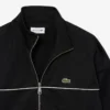 Sudadera con cremallera y detalles decorativos