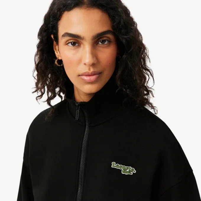 Sudadera con cremallera y insignia de corte holgado