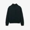 Sudadera con cuello alto, cremallera y detalle de insignia de la pasarela
