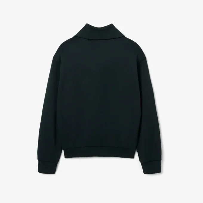 Sudadera con cuello alto, cremallera y detalle de insignia de la pasarela