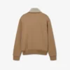 Sudadera con cuello alto, cremallera y detalle de insignia de la pasarela