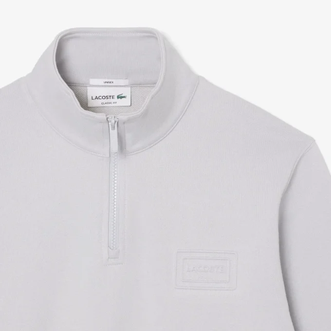 Sudadera con cuello alto y cremallera en relieve
