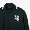 Sudadera con detalle de insignia en el cuello de polo de la pasarela