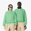 Sudadera unisex de corte holgado con detalle de insignia y media cremallera