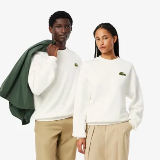 Sudadera unisex de felpa de corte holgado con detalle de insignia