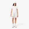 Vestido polo mini de piqué elástico de corte ajustado para mujer